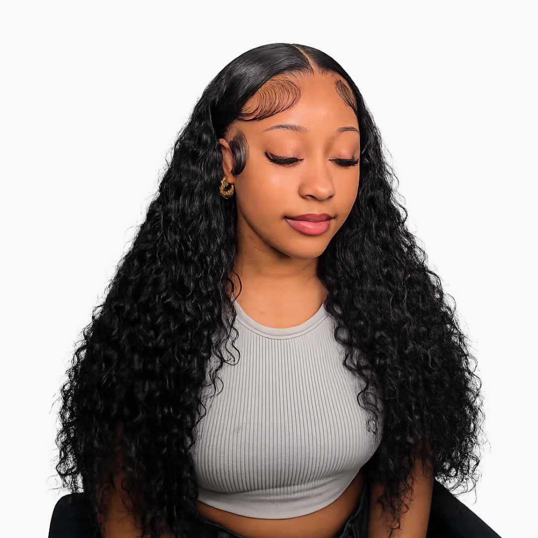 Young woman with long curly black hair and a ribbed gray crop top eyes closed in a serene pose